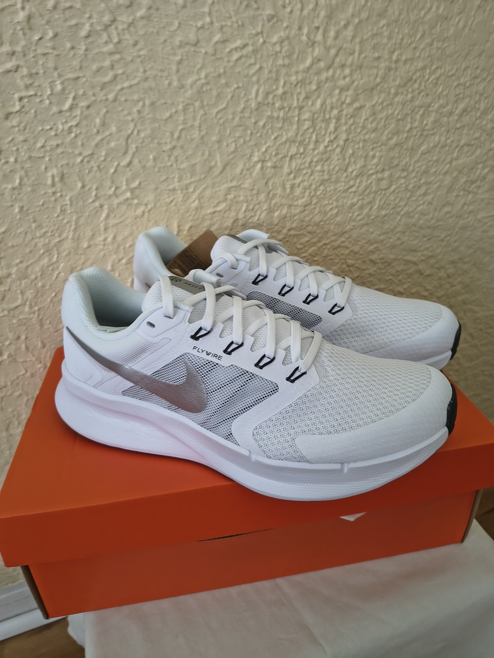 Nike Women’s White Sneakers with Silver Swoosh